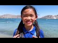 jannie and charlotte play on the beach with friends