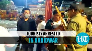 Watch: Tourists celebrate birthday at ghat \u0026 misbehave with cops, arrested