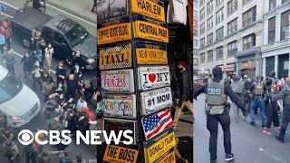 Videos show New Yorkers clashing with federal agents over ICE raid