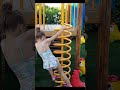 Kids playing at outdoor playground with slides