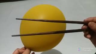 Deflating a balloon with chopsticks so we can use it again (watch the full video@lifeofms.a )