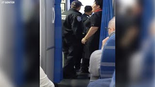 Passenger restrained aboard flight traveling from Poland to US