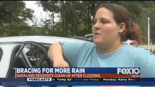 Saraland residents clean up after flooding