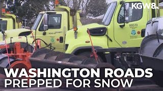 Washington state transportation officials treat roads ahead of potential sticking snow