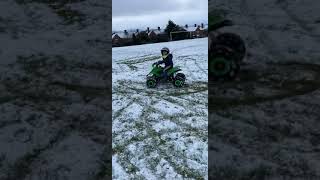 Quad bike in the snow sliding out