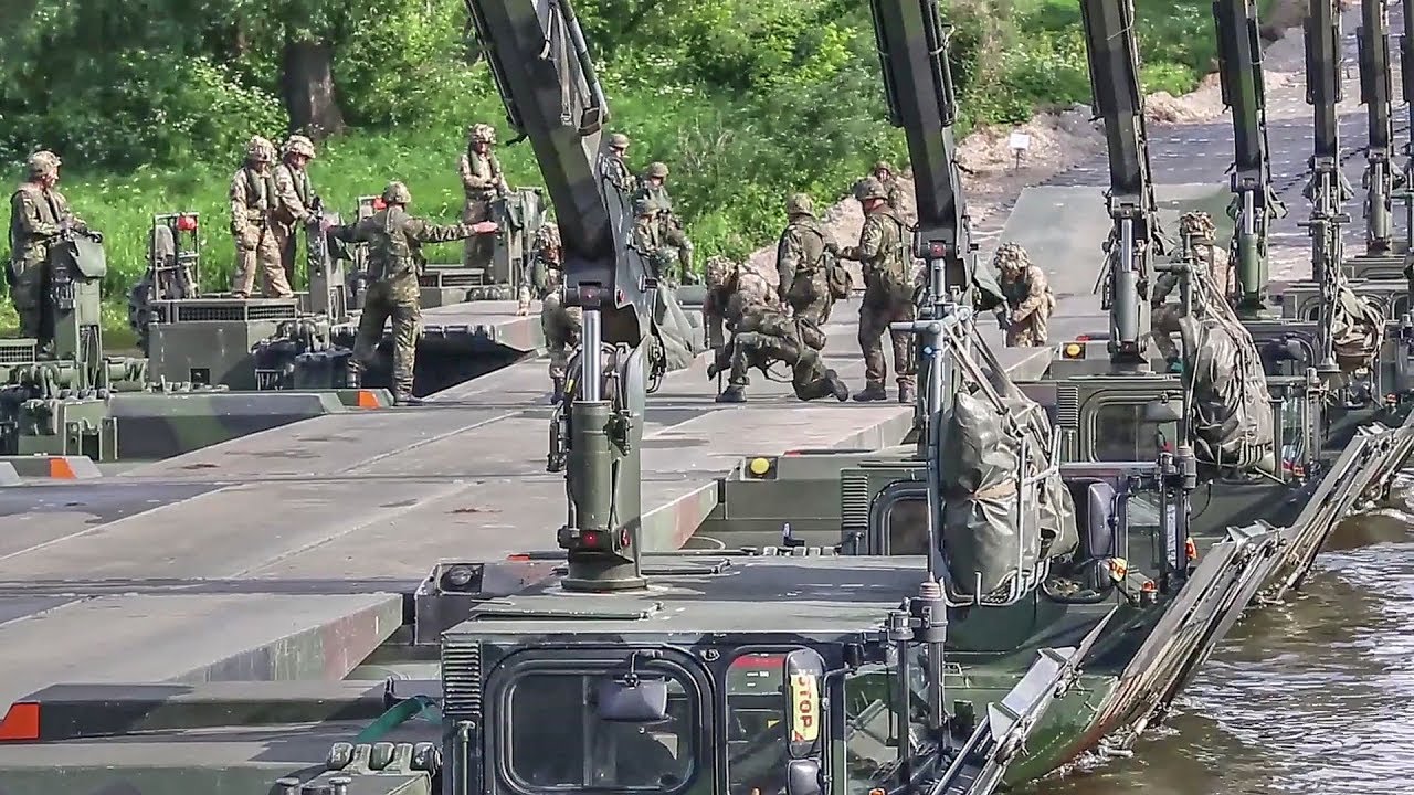 Troops Build Pontoon Bridge To Move Tanks Across River During NATO ...