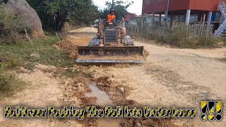 Bulldozer pushing the soil and tree into pit ! complete ! mitsubishi bd2g and dump truck working