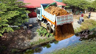 Filling The Small Pond In Village For Build The Small Warehouse By Bulldozer And Dump Truck