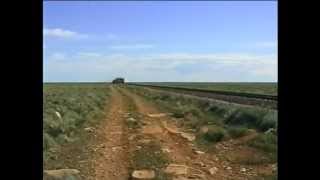 The 'singing rails' of a passing goods train, on the Nullarbor Plain.