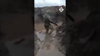 Ukrainian soldiers stuck in muddy trenches