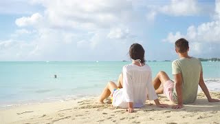 Couple Sitting On Beach Stock Video