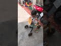 riding a children s tricycle 明峰騎兒童三輪車 三輪車 tricycle