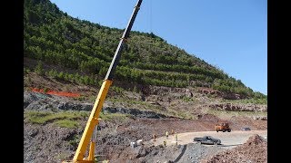 Crane lifting for ground investigation on quarry excavation bench