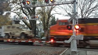 BNSF 7224 Military Vehicle Train With NS Passing H Street Railroad Crossing Northbound