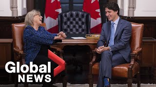 May meets with Trudeau, calls for changes to emissions