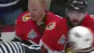 Daniel Alfredsson shoots the puck on Niedermayer