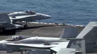 U.S. Navy Sailors direct aircraft on the flight deck aboard USS George H.W. Bush (CVN 77)