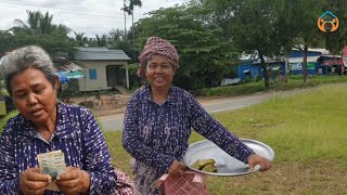 70-year-old Um Srey Phoeun sells Khmer cakes in Neak Leung West received Cambodian-American funds