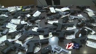 Providence police display seized guns