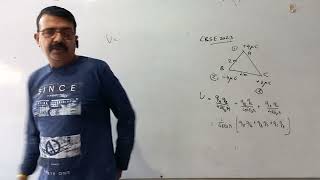 Three charges are placed at the corners of an equilateral triangle ABC of side 2m as shown in the