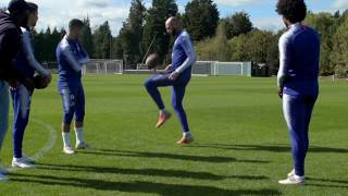 Eden Hazard displays his tekkers with an American Football .... A Thing of beauty!
