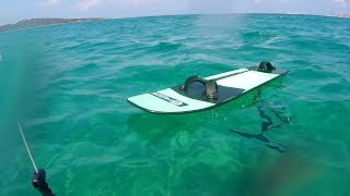 Hydrofoiling in emerald blue water, Porto Pollo