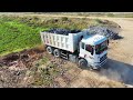 full video road project pour rocks into a large lake using a 25 ton trucks u0026wheel loader