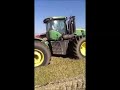 leon dozers m5000 on a john deere tractors pushing silage