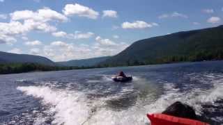 Camden doing some tubing on Honeoye Lake behind Rich's speedboat on 03-AUG-2013.