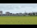 田んぼの向こうで普通列車どうしの離合シーン＠宮城県岩沼市