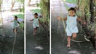 Girl Dodges Jumping Snake