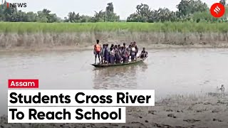 Students Of Primary School In Nalbari District Cross Tributary of Brahmaputra River To Reach School