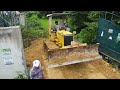 processing huge landfill bulldozer d31p prepares to the ground with precision 5t dump truck mix vdo