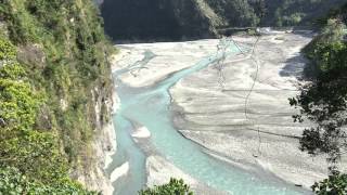 a serene river runs through beautiful Taroko Gorge National Park in Taiwan