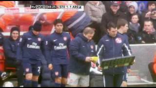 Arsene Wenger taking Andrei Arshavin's headgear off