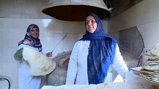 Traditional bread baking by village women . در این روستا زنان نانوا هستند