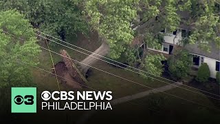 Residents clean up after strong storm knocks trees into homes in Pottstown, Pennsylvania