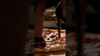 Sitting on table while crushing and trampling a delicious pizza in high heels. #crush #heels #food