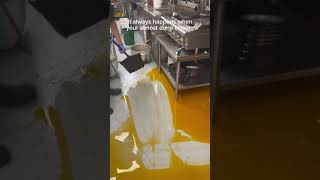 Kitchen staff accidentally spill oil on the floor!