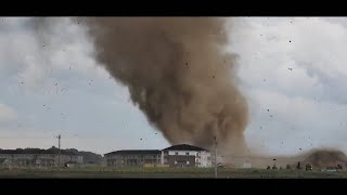 Debris spins through the air as tornado rips through Indiana buildings