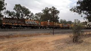 Pacific National's 5WM2 (NR38 - LDP009 - LDP005) power through Uranquinty, NSW.