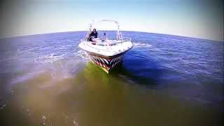 DRONE FLIES THREW  PARASAILING BOAT CHUTE N LOADS