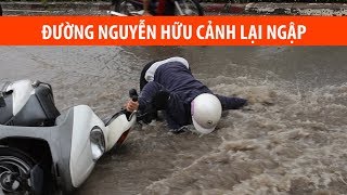 Ngã sấp mặt vì mưa lại ngập ở Sài Gòn
