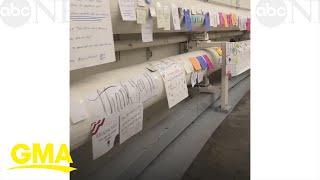 Hundreds of handwritten tributes for Capitol Police line wall inside the Capitol