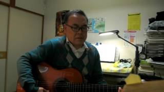 Hideo Iwasaki,actor is singing the gloomy music with the guitar.