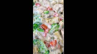 Creamy pasta chicken shrimp with broccoli and carrots