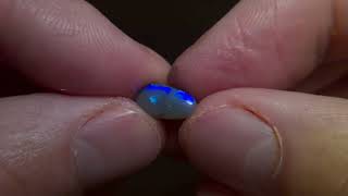 1.55cts Lightning ridge black opal rolling flash blue purple colour