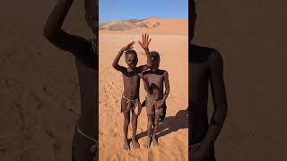 Two Himba boys being funny 02, Himba Village, east of Serra Cafema, Namibia, 2023-05-25