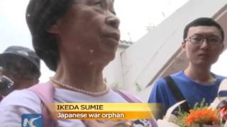 War orphans visit graves of Chinese parents