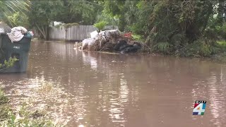 Residents in the Sans Pareil neighborhood still dealing with flooded streets